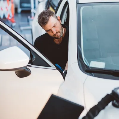 Technician repairing a vehicle
